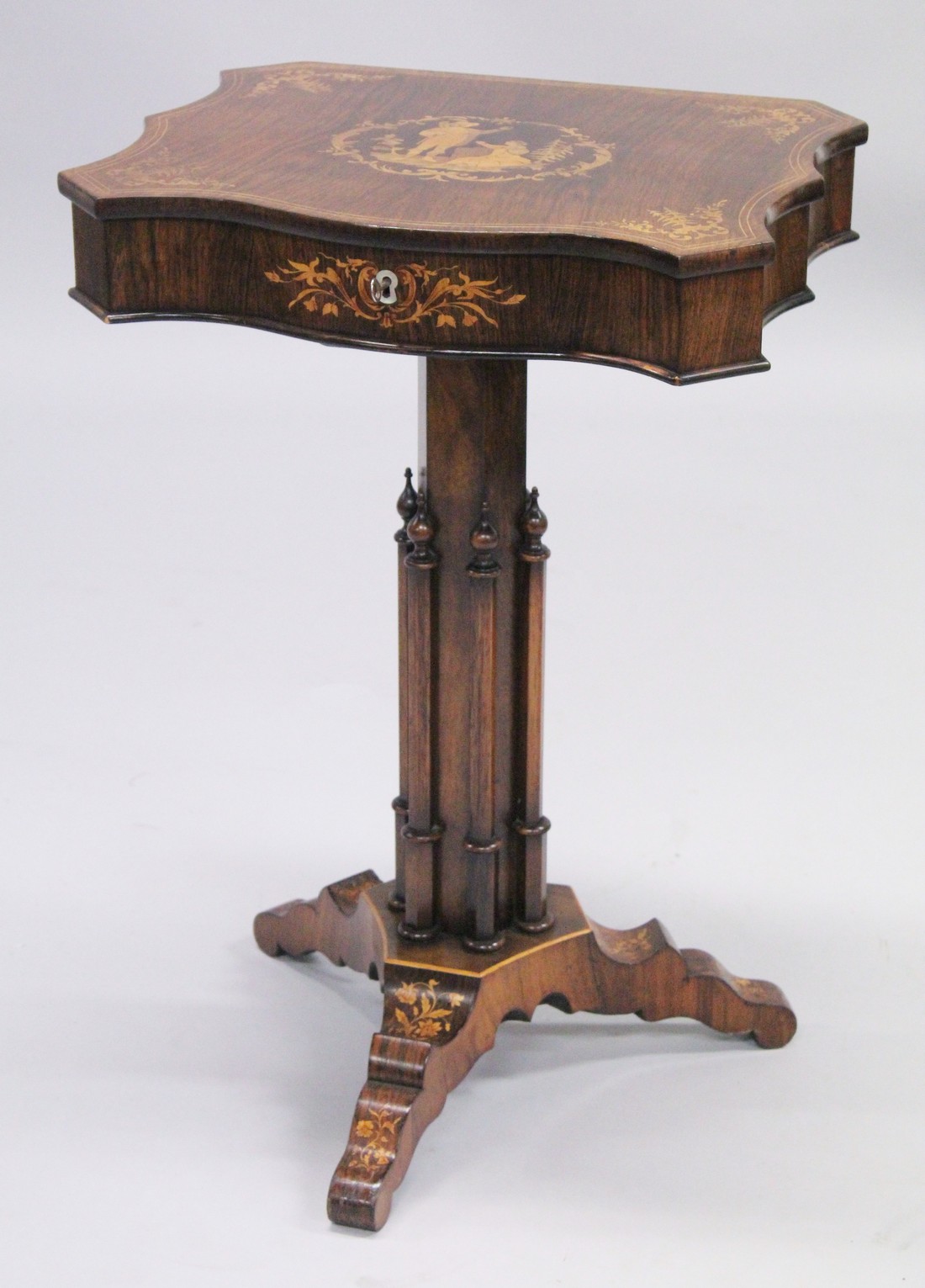 A SUPERB 19TH CENTURY ROSEWOOD INLAID SEWING TABLE, the shaped top with figures, opening to reveal a