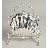 A SILVER PLATED SHELL DESIGN BISCUIT AND COVER STAND.