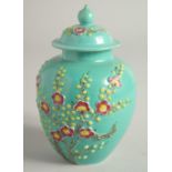 A SMALL CHINESE TURQUOISE GLAZE JAR AND COVER.