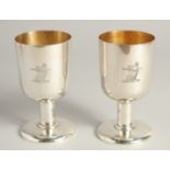 AN EXCELLENT PAIR OF SILVER GOBLETS BY R. J. J. with gilt interior. Griffin crest. 4.75ins high,