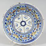 A 19TH CENTURY MAJOLICA BLUE AND YELLOW TIN GLAZE CHARGER. 13ins diameter.
