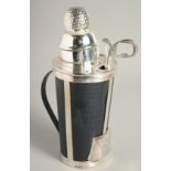 A SILVER PLATED GOLF BAG COCKTAIL SHAKER. 12ins high.