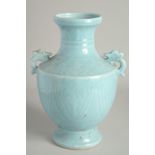 A CHINESE BLUE VASE with handles. 1ft high.