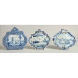 THREE 19TH CENTURY DUTCH BLUE AND WHITE SHAPED PLAQUES, a horse and rider pulling a barge, Boar