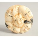 A CHINESE CARVED BONE NETSUKE. 1.5ins diameter.