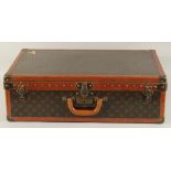 A LOUIS VUITTON SUITCASE. No. 810009 with Louis Vuitton label and ARTHUR GILBERT, New York. Lock no.