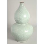 A CHINESE DOUBLE GOURD CELADON VASE. 1ft 3ins high.
