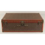 A LOUIS VUITTON SUITCASE. No. 920890, with Louis Vuitton label. Brass lock no 147171. Handle