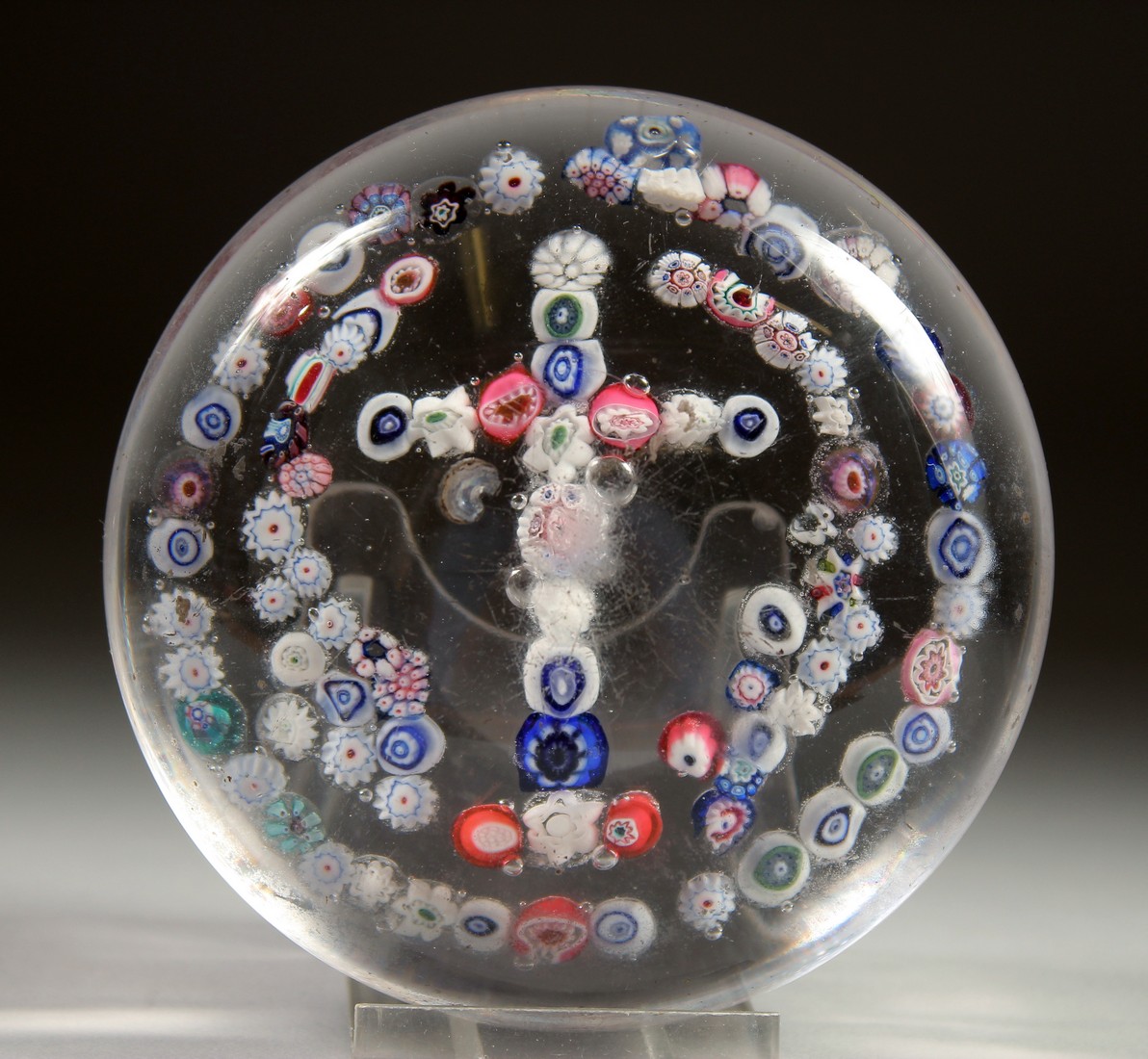 A MILLEFIORI CRUCIFIX PAPERWEIGHT. Possibly CLICHY. 3.5ins diameter.