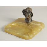 AN ART DECO BRONZE AN ONYX ASHTRAY, head of a boy.