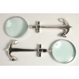 A PAIR OF MAGNIFYING GLASSES with anchor handles.