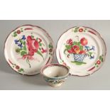 A PAIR OF CONTINENTAL PLATES painted with flowers in a basket 8.5ins diameter and A SMALL BOWL 4.