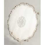 A SUPERB GEORGE II SILVER SALVER by JOHN TWITE, with pie crust border and engraved crest,
