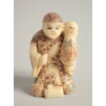 A BONE NETSUKE OF A MAN. Signed, 1.75ins.