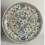 A CHINESE MING STYLE BLUE AND WHITE PLATTER. 1ft 11ins diameter.