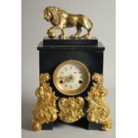 A GOOD FRENCH GILT BRONZE AND BLACK MARBLE CLOCK with lion surmount. 1ft 5ins high.
