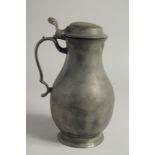 AN 18TH CENTURY PEWTER FLEMISH PEWTER FLAGON AND COVER. 11ins high.