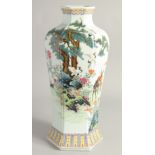 A CHINESE FAMILLE ROSE HEXAGONAL FORM VASE decorated with deer and cranes in a woodland setting.