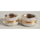 A GOOD PAIR OF 18CT WHITE AND YELLOW GOLD PARVE SET TWO ROW DIAMOND EARRINGS. 49.6gms.