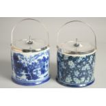 TWO SILVER PLATED AND PORCELAIN CIRCULAR BISCUIT BARRELS AND COVERS.