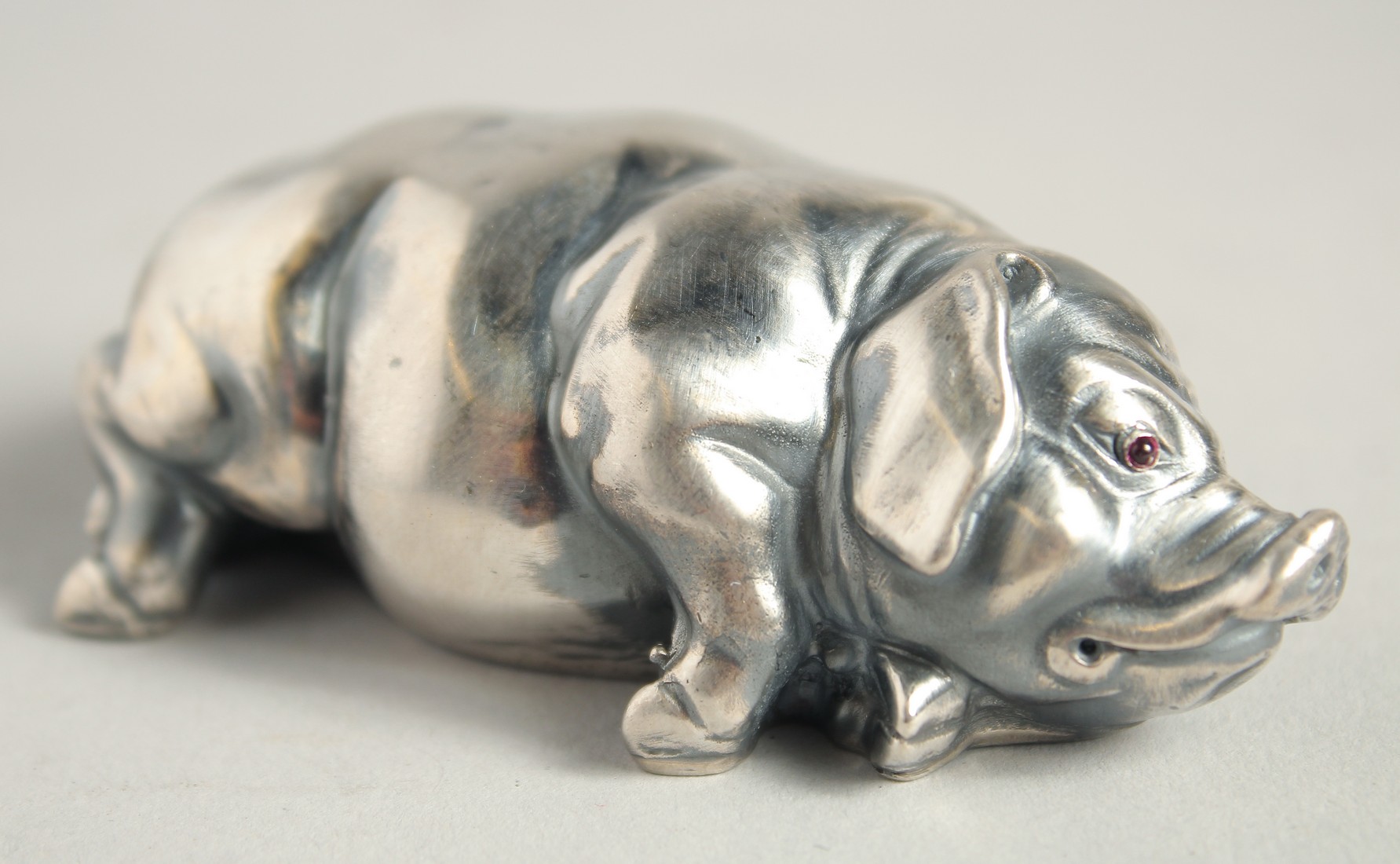 A SMALL RUSSIAN SILVER SLEEPING PIG, 2.75ins long. Mark I.P. Head 84, Eagle, Faberge mark.