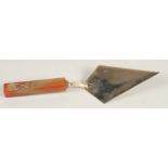 A RUSSIAN 14CT GOLD TROWEL WITH JADE HANDLE, with medallions in diamonds. 8ins long, mark H. W. head