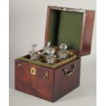 A GOOD GEORGIAN SQUARE MAHOGANY DECANTER BOX AND COVER with brass carrying handle and filled with