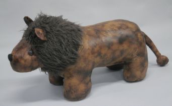 A LEATHER LION STOOL (LIBERTY DESIGN). 2ft 6ins long.