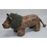 A LEATHER LION STOOL (LIBERTY DESIGN). 2ft 6ins long.