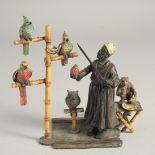 A VIENNA COLD CAST PAINTED GROUP OF THE PARROT VENDOR a monkey by his side. 6.5ins long.