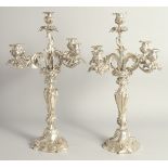 A GOOD PAIR OF LOUIS XVI DESIGN FOUR BRANCH CANDELABRA with acanthus leaves and scrolls. 20ins