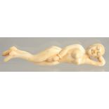 A CARVED BONE NUDE FIGURE 5ins long.