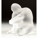 A LALIQUE FROSTED GLASS FIGURE sitting crossed leg. Signed. 3ins in a Lalique box.