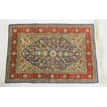 A GOOD SMALL SHIRVAN SILK RUG, blue ground with floral decoration in a red ground border. 3ft 1ins x