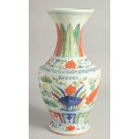 A LARGE CHINESE WUCAI PORCELAIN VASE painted with fish and algae. 38cm high.