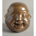 A BRASS FOUR FACE BUDDHA. Signed, 4.5ins