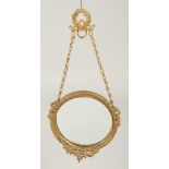 A GILT METAL CIRCULAR PHOTOGRAPH FRAME 3.5ins