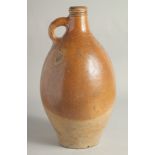 A LARGE EARLY STONEWARE FLAGON. 16ins high.