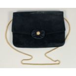 A BLACK VELVET EVENING BAG 6.5ins x 9.5ins with gilt stud.