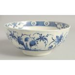 AN 18TH CENTURY WORCESTER BOWL painted with the uncommon Late Rock Floral pattern, crescent mark.