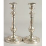 A PAIR OF FRENCH PLAIN CANDLESTICKS. 9.5ins high.