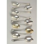 A COMPOSITE SET OF NINE EARLY GEORGIAN SILVER RAT TAIL DESSERT SPOONS. London 1729 and other