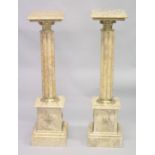 A GOOD PAIR OF CLUSTER COLUMNS on pedestal bases. 3ft 3ins high.