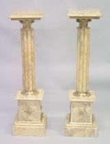 A GOOD PAIR OF CLUSTER COLUMNS on pedestal bases. 3ft 3ins high.