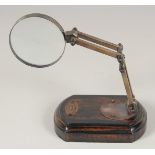 A MAGNIFYING GLASS on a stand.