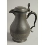 A LARGE 18TH CENTURY PEWTER JUG AND COVER. 10ins high.