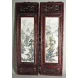 A PAIR OF LONG FRAMED CHINESE WALL PLAQUES.