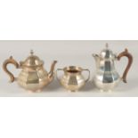 A THREE PIECE OCTAGONAL TEA SET, tea pot, hot water jug and sugar basin. Birmingham, mark rubbed,