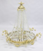 A LARGE ORMOLU AND CRYSTAL CIRCULAR CHANDELIER with four rows of prism drops, six triple pairs of