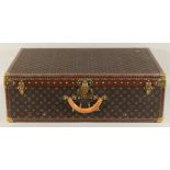 A LARGE LOUIS VUITTON SUITCASE. No. 1068754. With Louis Vuitton label. Lock no. 1262082. 31.5ins